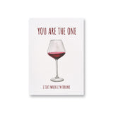 a card with a glass of red wine on it