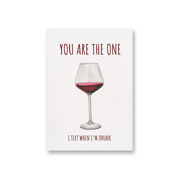 a card with a glass of red wine on it