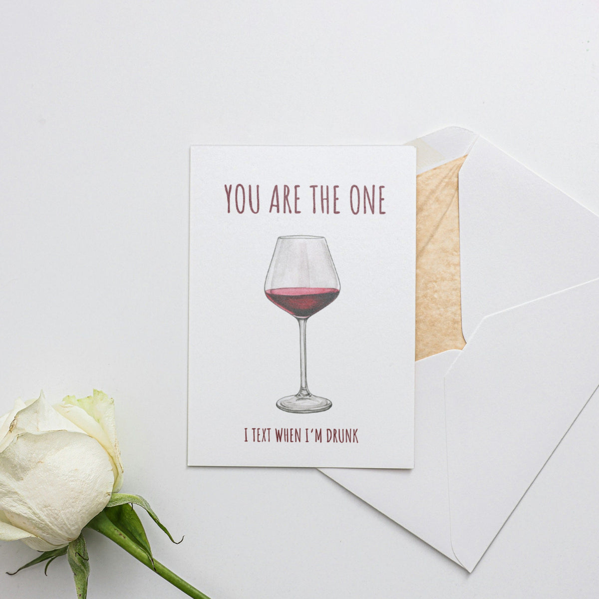 a card with a glass of wine on it