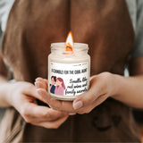 a woman holding a candle in her hands