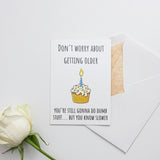 a card with a birthday cupcake on it