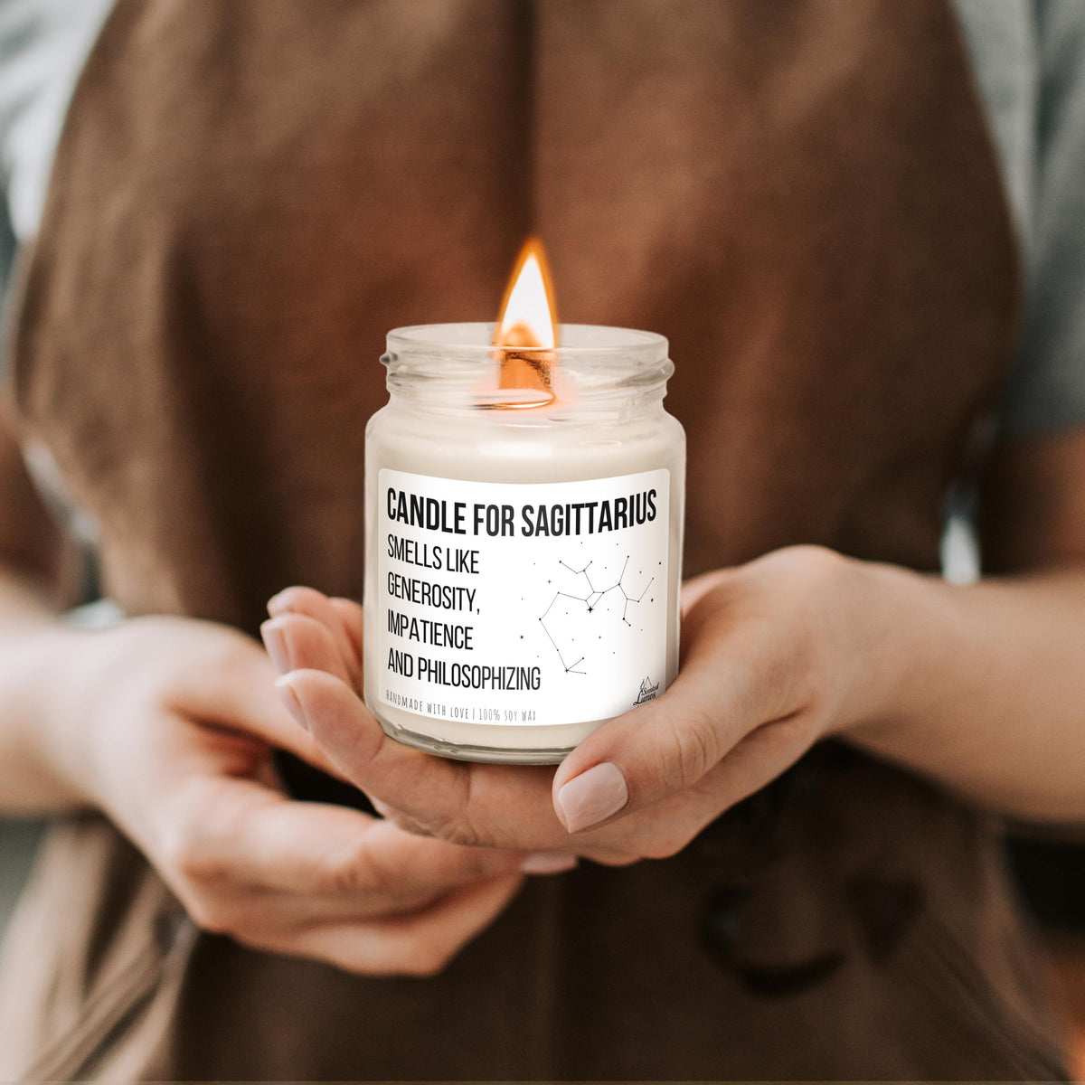 a person holding a candle in their hands