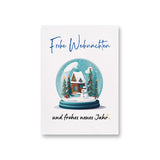 a christmas card with a snow globe with a house inside